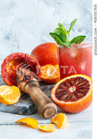 Icy juice from the blood orange and citrus press. Icy juice from the blood orange and citrus press. 40656769