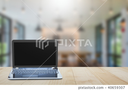 Computer laptop on wooden tabletop Computer laptop on wooden tabletop 40659307