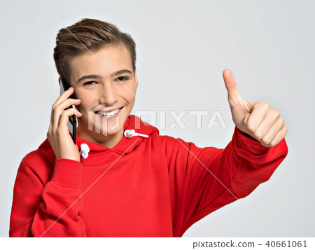 Young teenager calling by mobile phone Young teenager calling by mobile phone 40661061