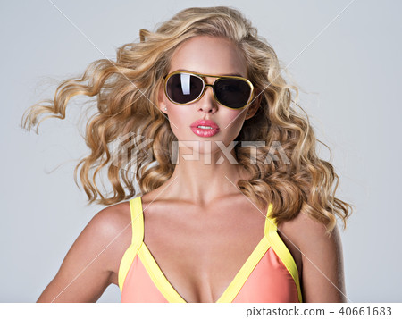 Beautiful blonde woman with long wavy hair 40661683