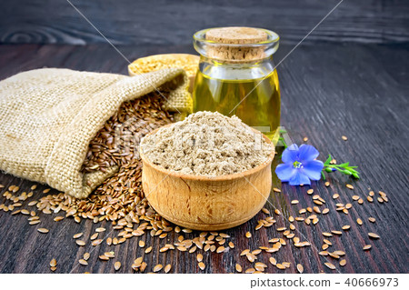 Flour linen in bowl with oil and flower on board Flour linen in bowl with oil and flower on board 40666973