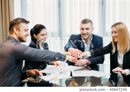 teamwork unity business people hands together 40667298