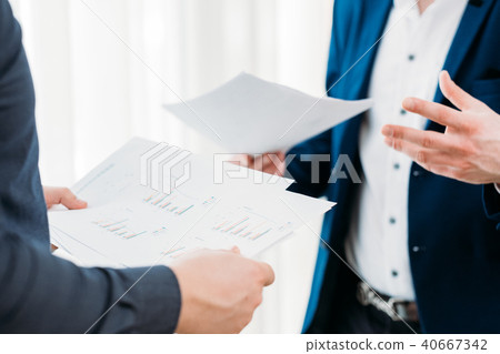 business communication coworkers discuss documents business communication coworkers discuss documents 40667342