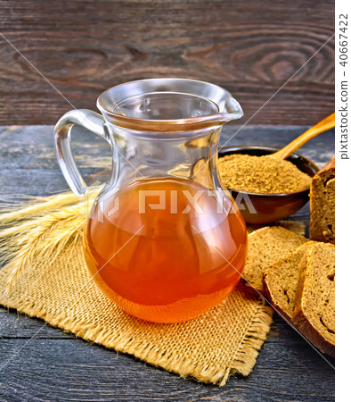 Kvass in glass jug on board Kvass in glass jug on board 40667422