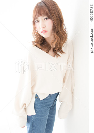 A woman closest to the wall A woman closest to the wall 40668788