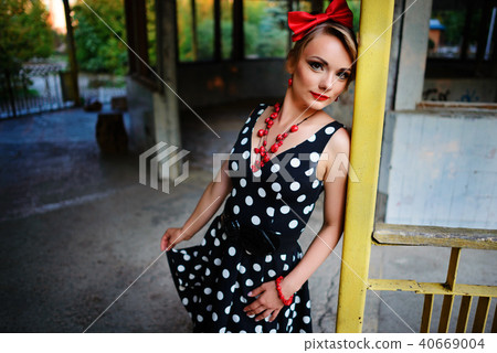 beautiful young woman posing in retro dress beautiful young woman posing in retro dress 40669004
