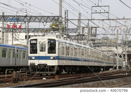 Tobu Noda Line 8000 series train passing in front of Kasukabe Station 40670796