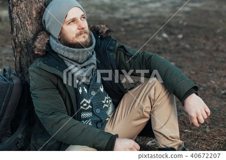 Pensive hipster guy wanderlust  40672207