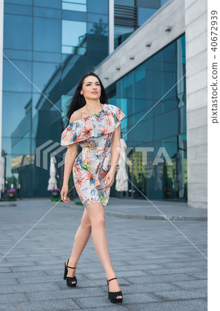 pretty woman walking outdoors 40672939