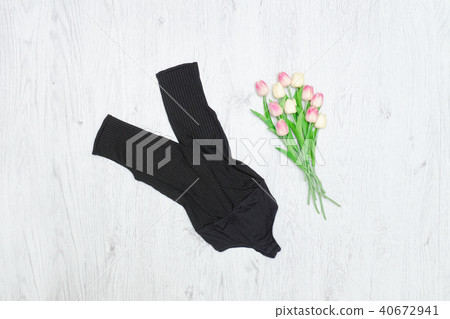 Black body and bouquet of tulips Black body and bouquet of tulips 40672941