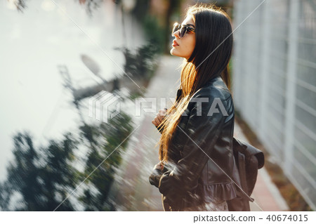 stylish girl walking through the city 40674015