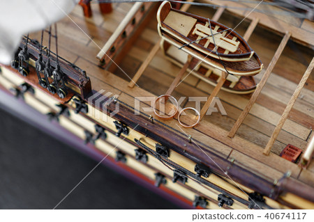 Wedding Rings on Wood model of the medieval ship. Bride and groom accessories. Maritime concept 40674117