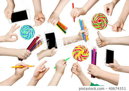 Set of child hands with pencils, phone, lollipop Set of child hands with pencils, phone, lollipop 40674351