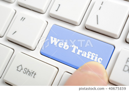 Pressing blue web traffic key on keyboard Pressing blue web traffic key on keyboard 40675839