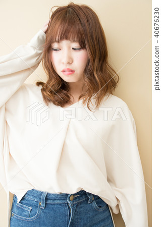 Woman handing her hair 40676230