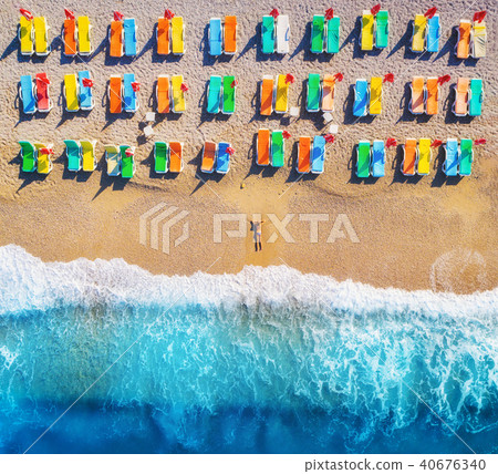 Aerial view of lying woman on the beach Aerial view of lying woman on the beach 40676340