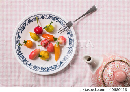Sweet dessert in fruit shape on dish Sweet dessert in fruit shape on dish 40680418