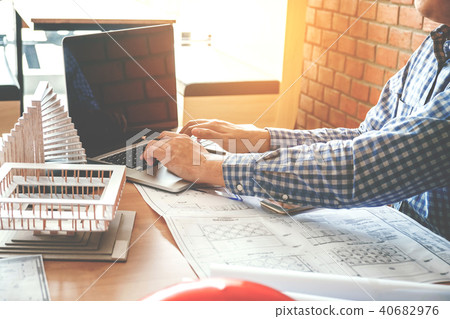 Architect or engineer working in office  blueprint 40682976