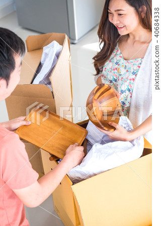 Couple buy a new home. Moving into the house. 40684338