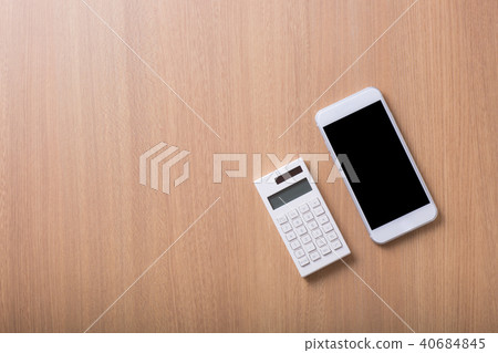 White smartphone and calculator 40684845