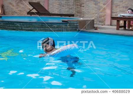 Cute little asian boy swimming pool Cute little asian boy swimming pool 40688029