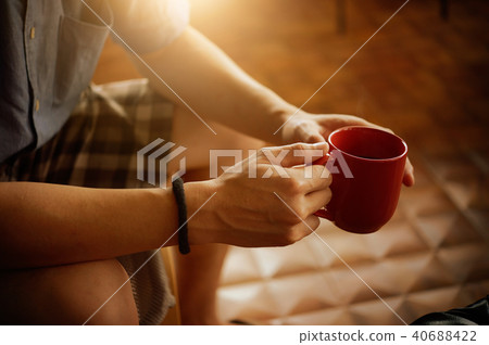 man hands holding cup of coffee man hands holding cup of coffee 40688422