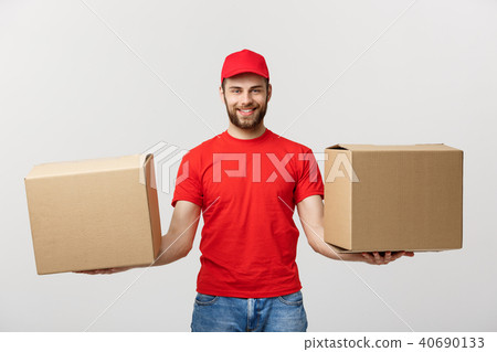 Delivery Concept: Portrait smiling delivery man giving cardbox on white background. Delivery Concept: Portrait smiling delivery man giving cardbox on white background. 40690133