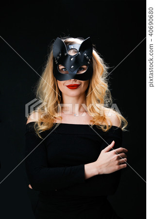 Photo of blonde in mask with arms crossed at waist Photo of blonde in mask with arms crossed at waist 40690680