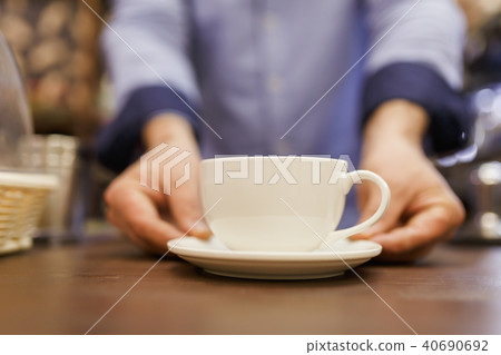 Image of barist man with cup of coffee Image of barist man with cup of coffee 40690692