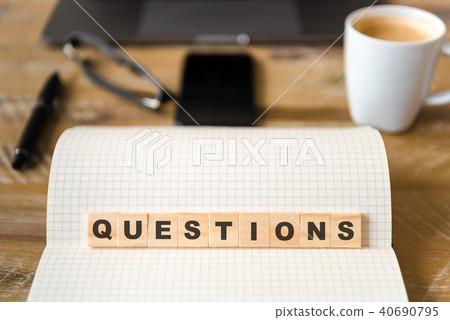 Wooden blocks with letters making QUESTIONS word 40690795
