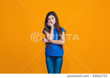Young serious thoughtful teen girl. Doubt concept. Young serious thoughtful teen girl. Doubt concept. 40692733