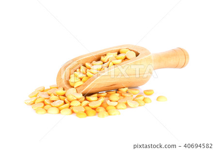 Yellow beans seeds in wood scoop on white Yellow beans seeds in wood scoop on white 40694582
