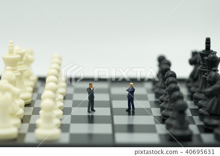 Miniature 2 people businessmen standing on a  40695631