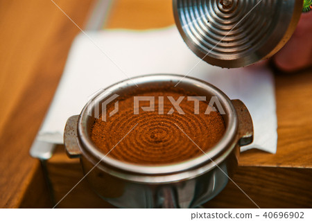 barista prepares coffee in the holder 40696902