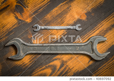 Two wrenches on wooden background. 40697092