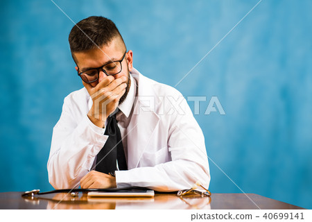 Worried doctor showing concern on the table 40699141