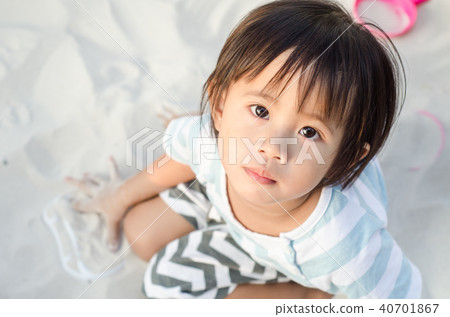 Little asian girl playing with sand Little asian girl playing with sand 40701867