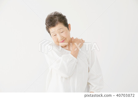 Elderly female stiff neck 40703872