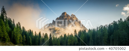 Forest and mountain range at sunrise landscape. Forest and mountain range at sunrise landscape. 40705002