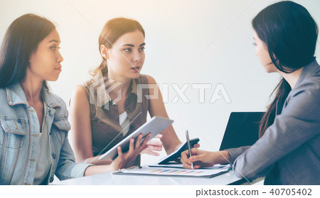 Multicultural businesswomen in group meeting. 40705402