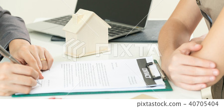 Client Signs Document to Buy House and Real Estate Client Signs Document to Buy House and Real Estate 40705404