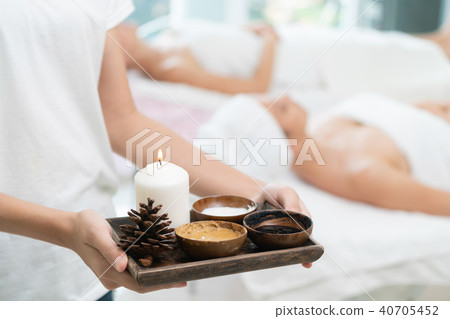 Massage therapist with hot spa treatment set. Massage therapist with hot spa treatment set. 40705452