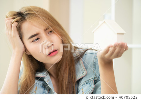 Young woman planning to buy a house. Young woman planning to buy a house. 40705522