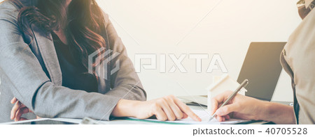 Client Signs Document to Buy House and Real Estate 40705528