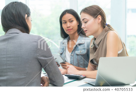 Multicultural businesswomen in group meeting. Multicultural businesswomen in group meeting. 40705533