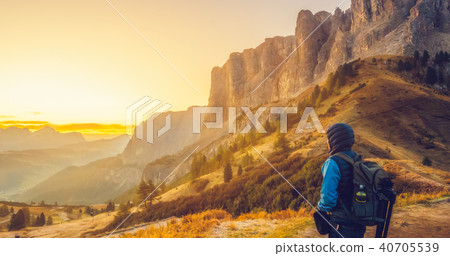 Traveler hiking breathtaking landscape of Dolomite Traveler hiking breathtaking landscape of Dolomite 40705539