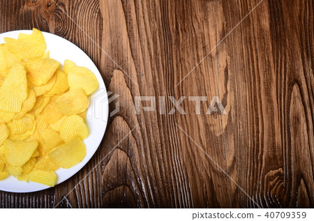 Pretzels, chips and salsa dip 40709359