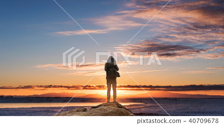 a man with backpack standing looking sunrise a man with backpack standing looking sunrise 40709678