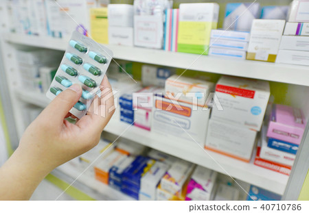 Pharmacist holding medicine capsule pack Pharmacist holding medicine capsule pack 40710786