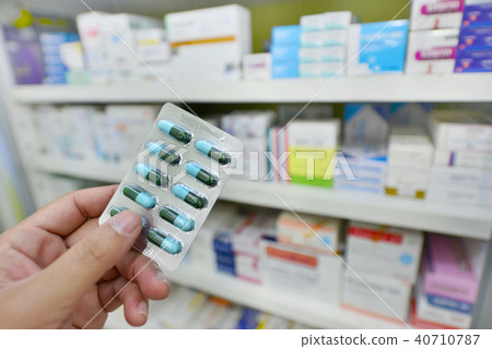Pharmacist holding medicine capsule pack Pharmacist holding medicine capsule pack 40710787